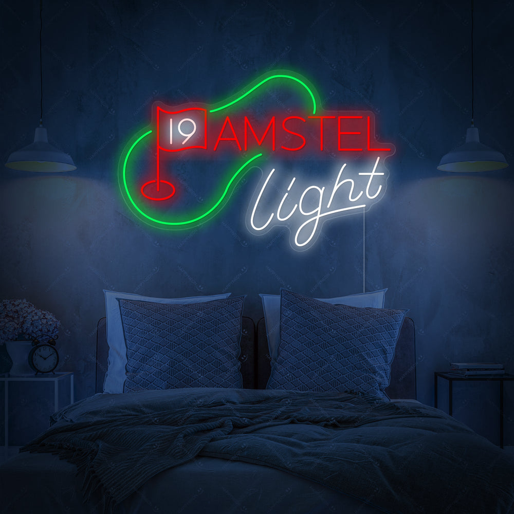 A vibrant neon sign featuring the text "19th Hole" and "Golf Beer" alongside the Amstel Beer logo, mounted on a dark wooden wall.