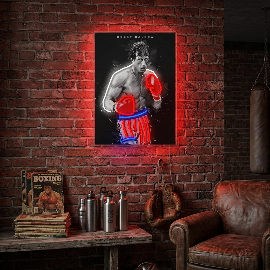 A stunning visual representation of the "Boxing Legend" neon sign, showcasing a boxer in an athletic stance with vibrant yellow light, displayed in a stylized living room against a dark wall with curated yellow furniture, creating a knockout pop-art vibe.