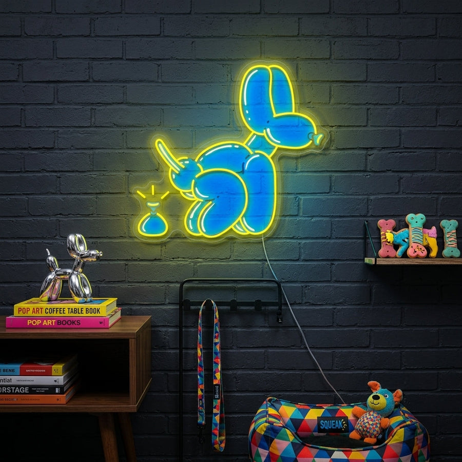 Balloon Dog Poop Joke neon sign displayed on a living room wall as humorous Pop Art decor