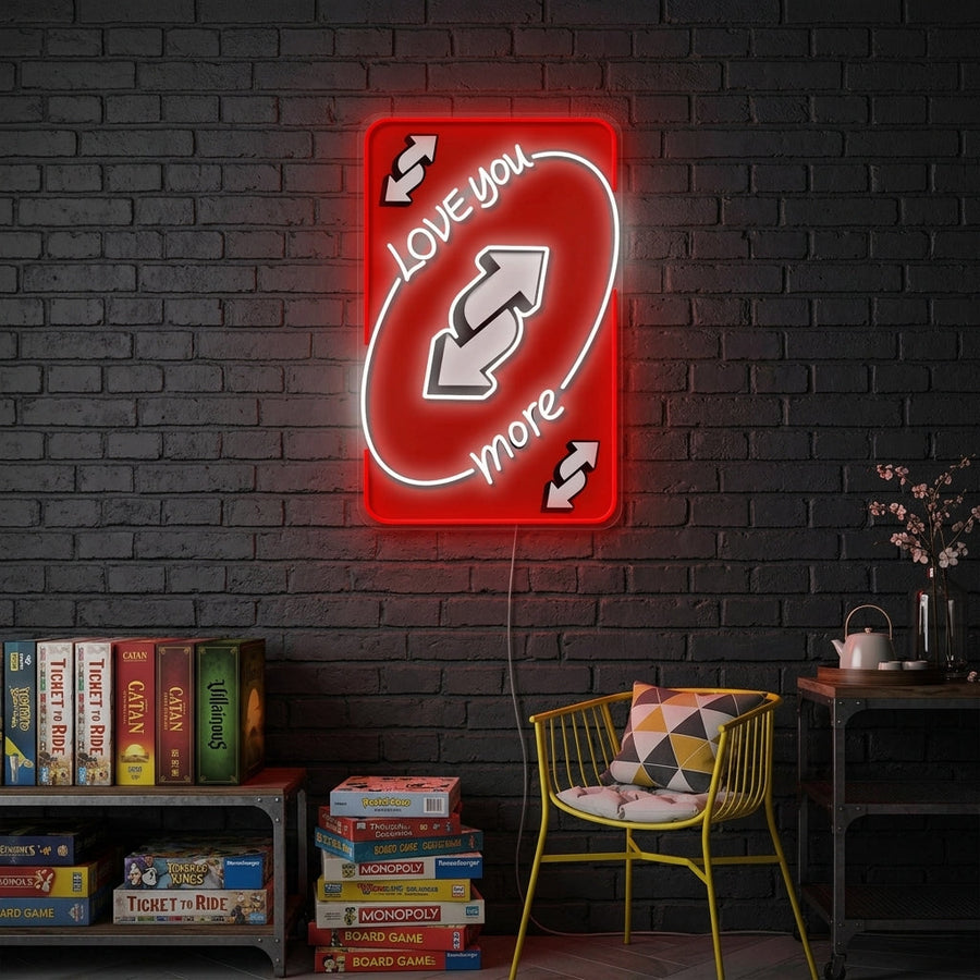 A vibrant 'UNO Love You More' neon sign glowing on a wall, depicting a playful design based on the UNO card game theme.