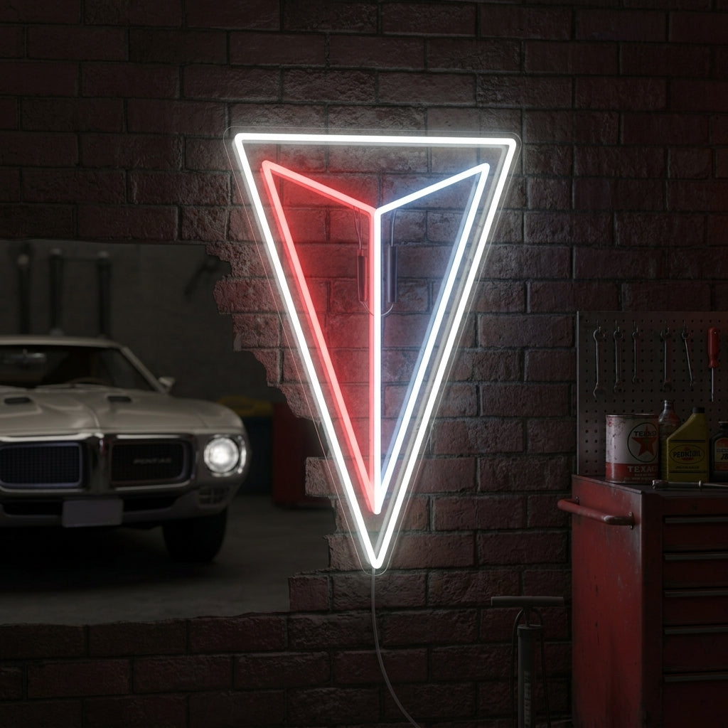 A stunning hand-made Pontiac Triangle neon sign brightly illuminated and mounted on a rustic brick wall, casting a warm red, white, and blue glow.