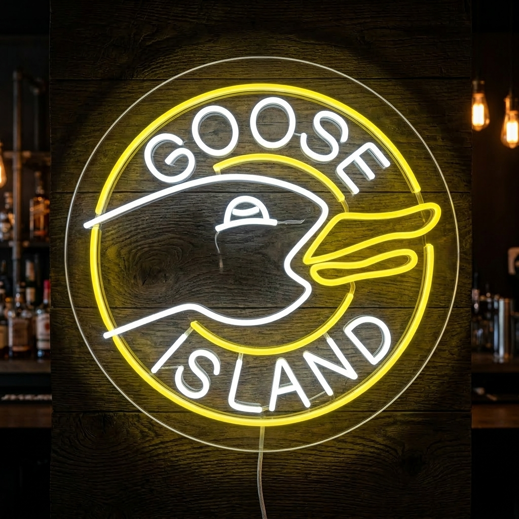 A glowing 'Goose Island Bar' neon sign featuring the black goose logo and yellow 'Bar' text against a dark bar background.