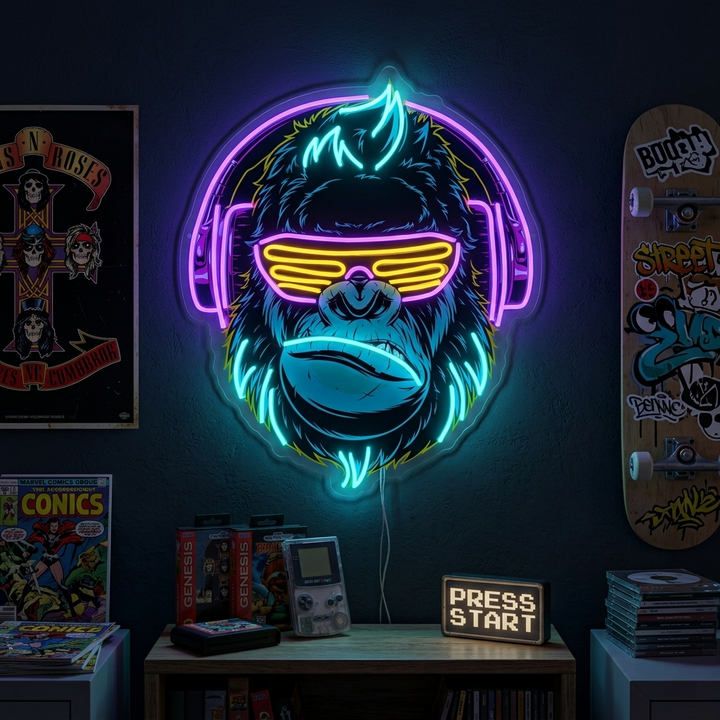 Cyberpunk Monkey neon sign featuring a glowing ape with large headphones, mounted on a wall in a gaming room setting above a console and controllers.