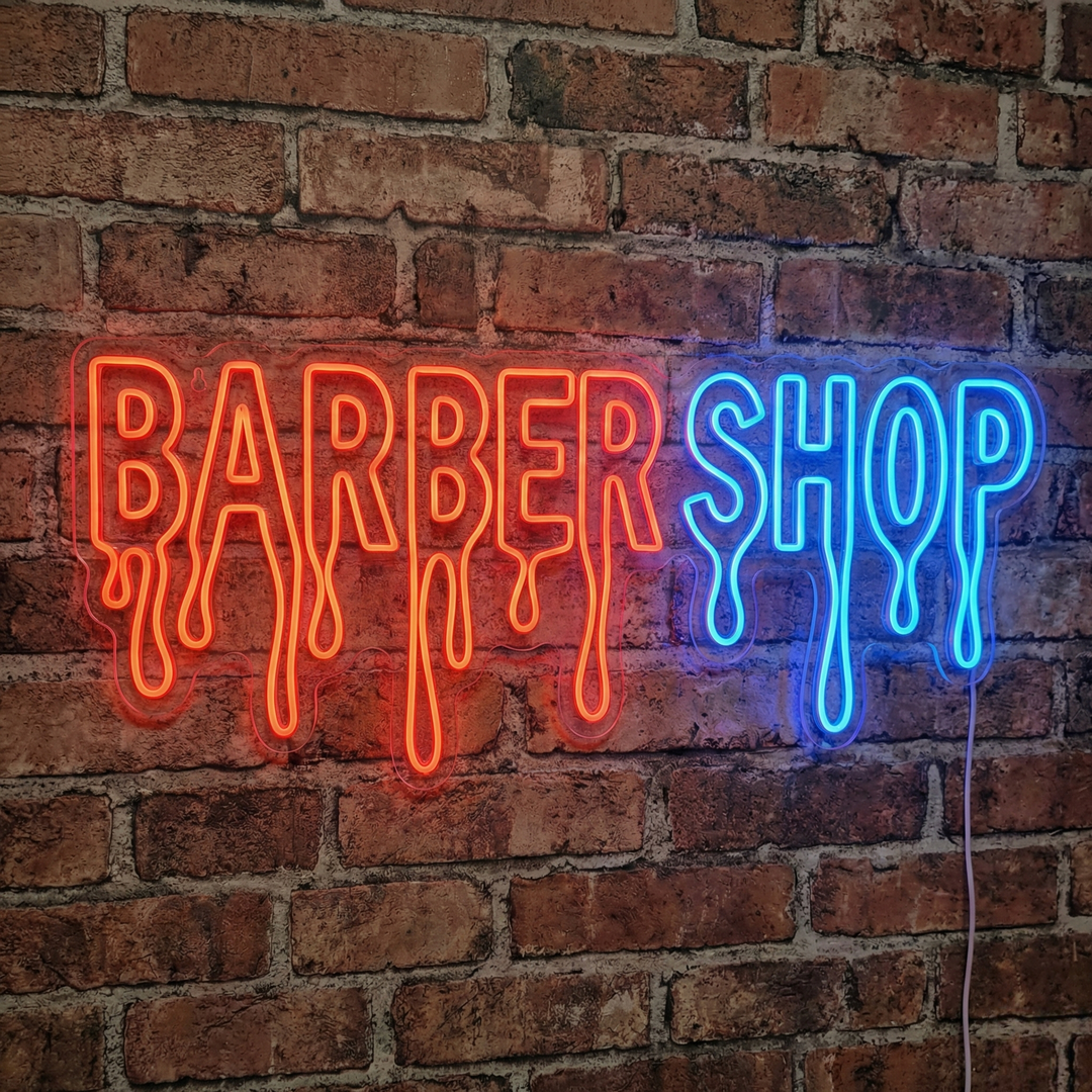 A close-up photograph of a lighted 'Barbershop' neon sign mounted on a brick wall, showcasing the physical tubing.