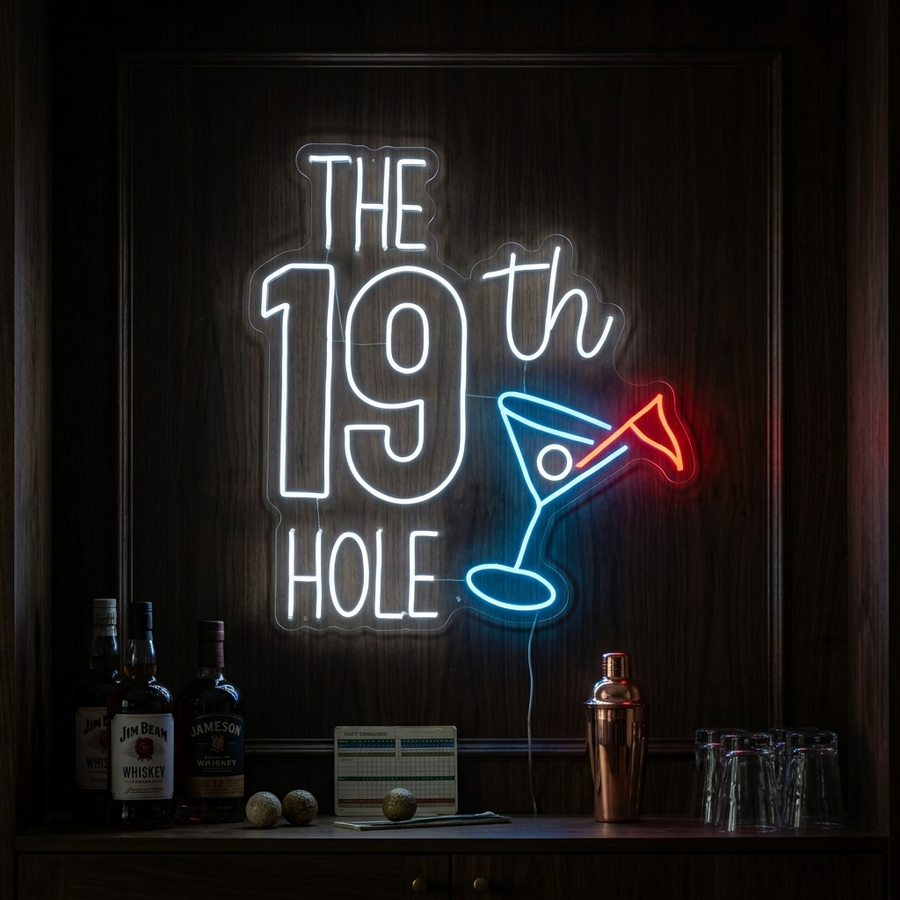 A close-up photograph of 'The 19th Hole Golf' neon sign, fully illuminated with white and green colors, mounted on a clear acrylic background behind a small home bar setting with a golf scorecard.