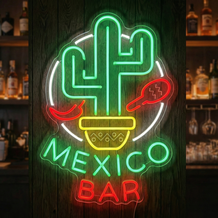 A vibrant 'Mexico Bar' neon sign glowing red, featuring stylized text and a small cactus graphic, mounted on a rustic wooden wall with blurred liquor bottles in the background.