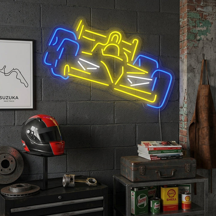 A sleek blue Formula A racing car neon sign illuminating a bedroom wall above a bedside table.
