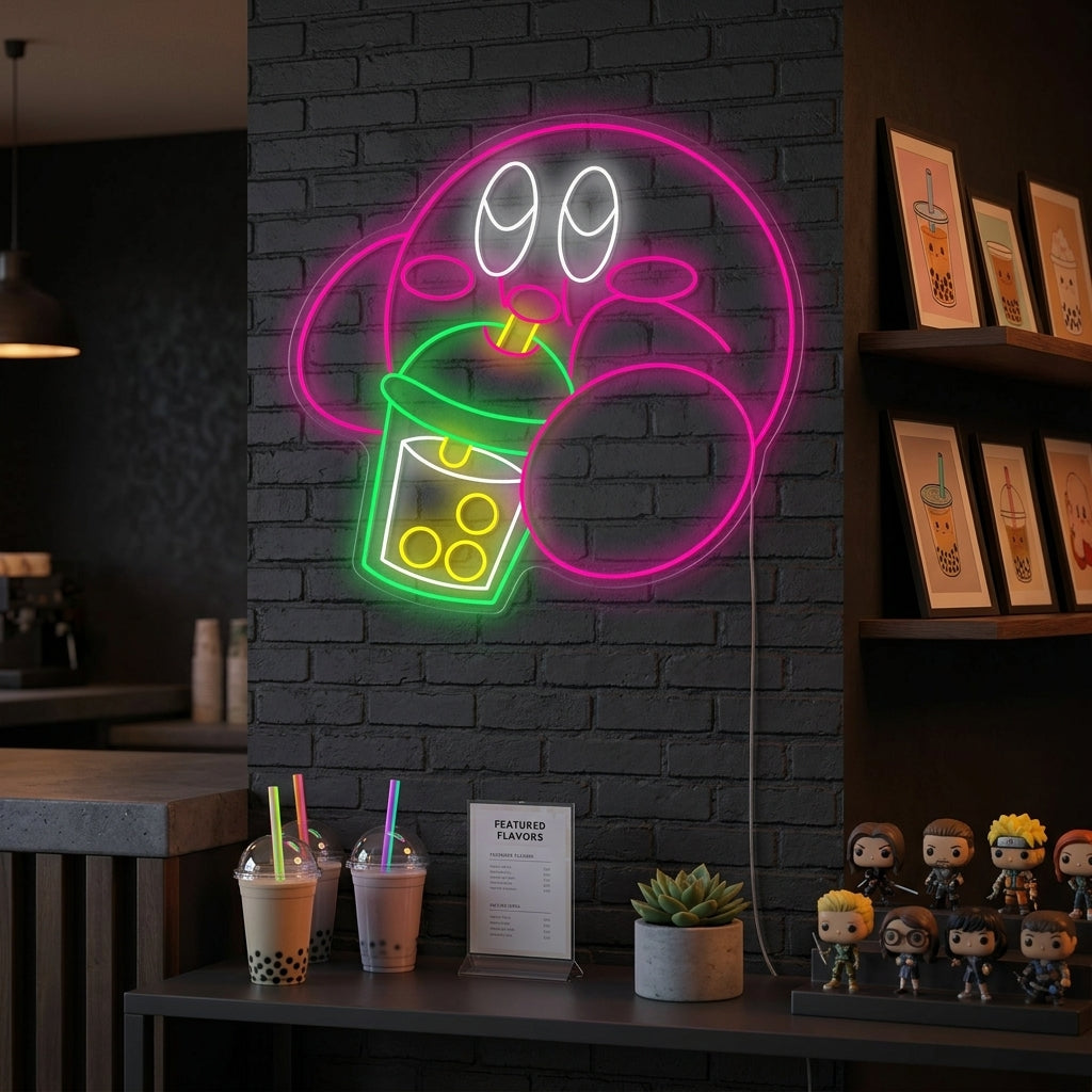 Kirby Drinking Boba Tea neon sign glowing brightly as wall decor in a modern boba shop setting.
