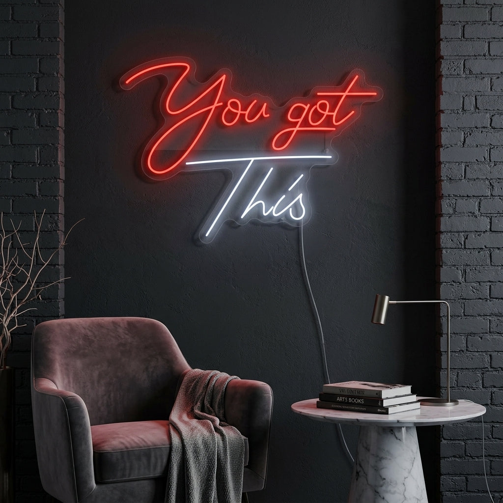 'You Got This' neon sign glowing in a motivating office environment above a desk.