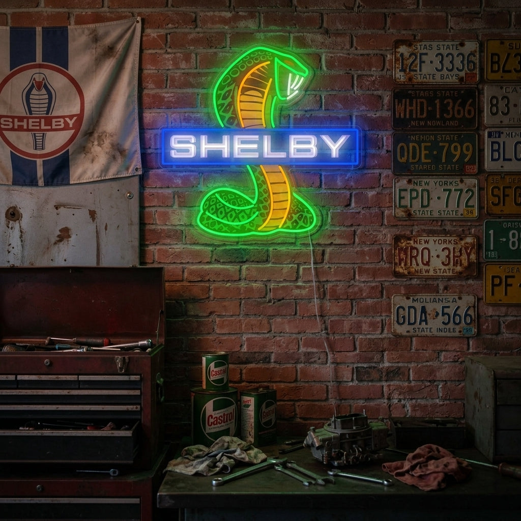 Shel-Car Cobra neon sign glowing brightly on a brick wall in a modern garage, showcasing the blue cobra and yellow text with a sports car in the background.