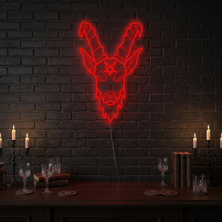 Baphomet Gothic neon sign glowing in a dark, atmospheric room.