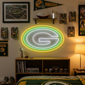 Green Bay Packers neon sign featuring the iconic 'G' logo glowing on a wall.