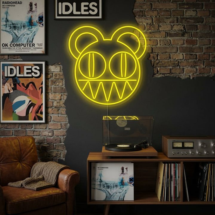 A glowing Radiohead neon sign displayed on a dark brick wall in a modern living room setting.