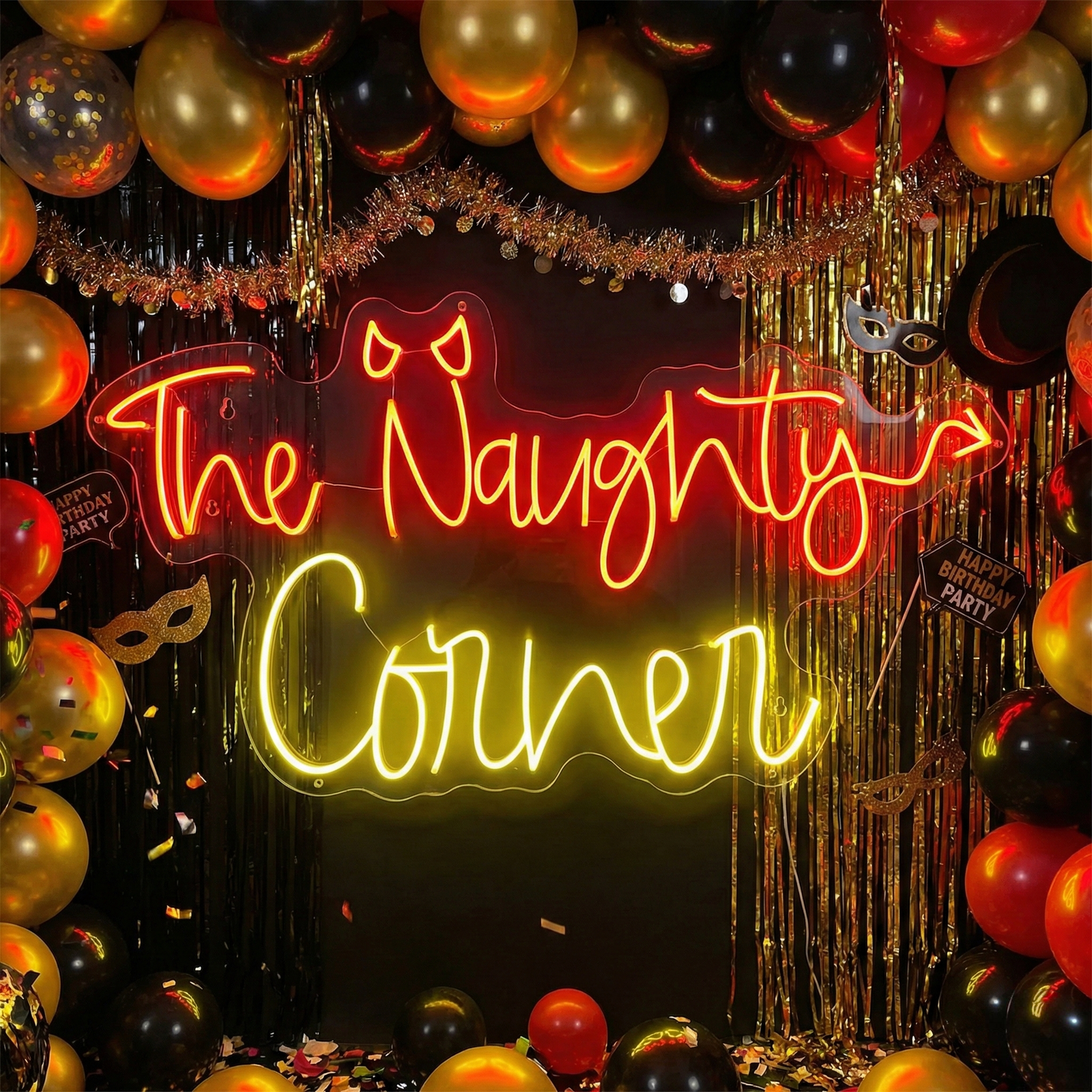 Close-up photograph of 'The Naughty Corner' neon sign illuminated in a red script font, set against a blurred background of party decorations like balloons.