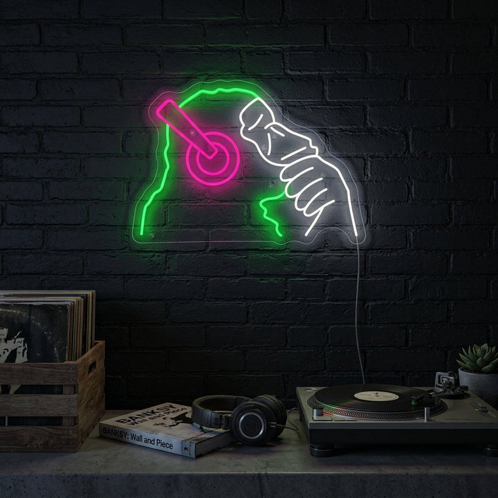 A stylish apartment living room with the Banksy Dj Monkey Neon Sign glowing above a modern sideboard, creating a cool and artistic atmosphere.
