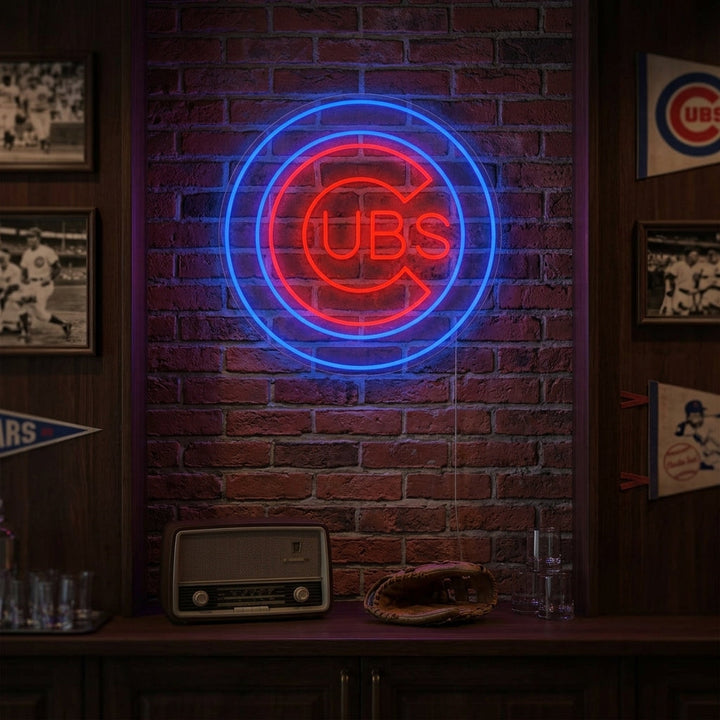 A 'CUBS' neon sign glowing brightly in a home bar or game room setting.