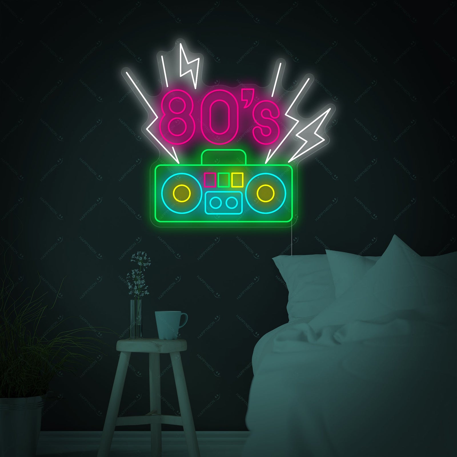 A graphic representation of an 80's retro neon sign featuring a pink sunset and blue palm trees above a bed in a room with vintage arcade posters.