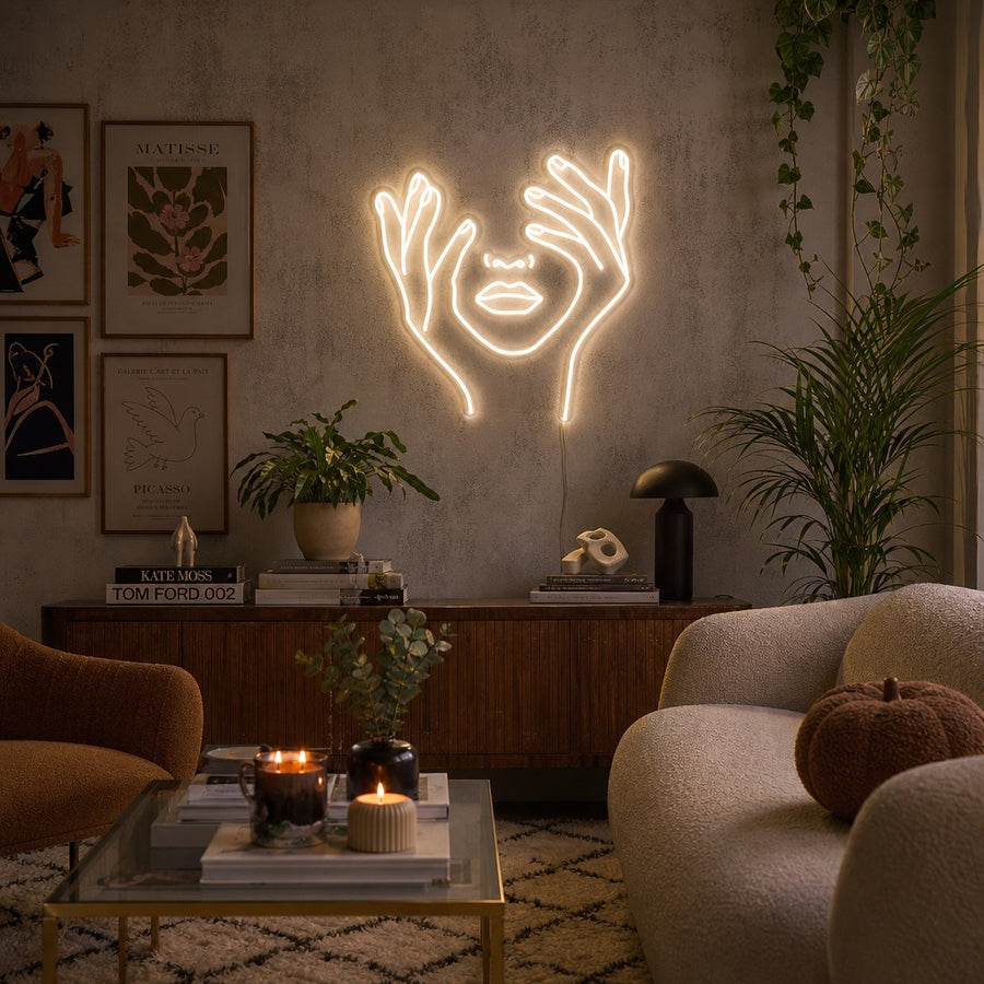 Abstract Face Hand Neon Sign illuminating a modern living room