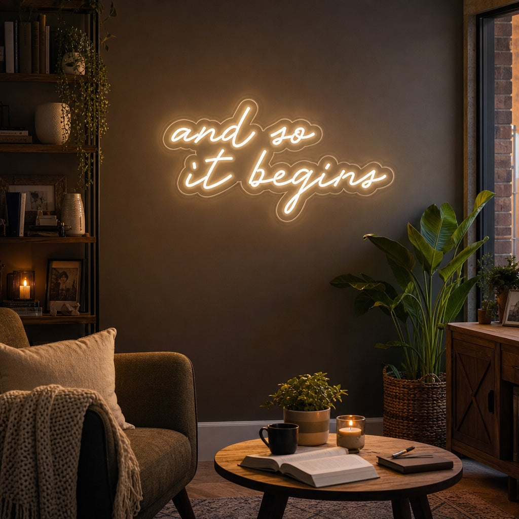 Lifestyle photograph of the 'And So It Begins' neon sign illuminated on a decorated wall.