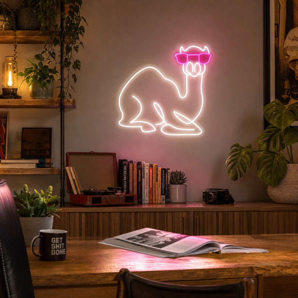 A stylish 'Camel with Glasses' neon sign illuminates a cozy living room wall above a modern sofa, creating a fun and quirky focal point.