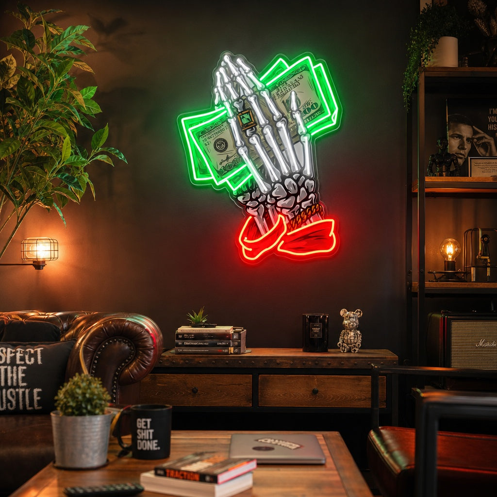 A colorful UV printed neon sign depicting skeleton hands holding dollar bills, glowing brightly above a yellow sofa in a modern room.