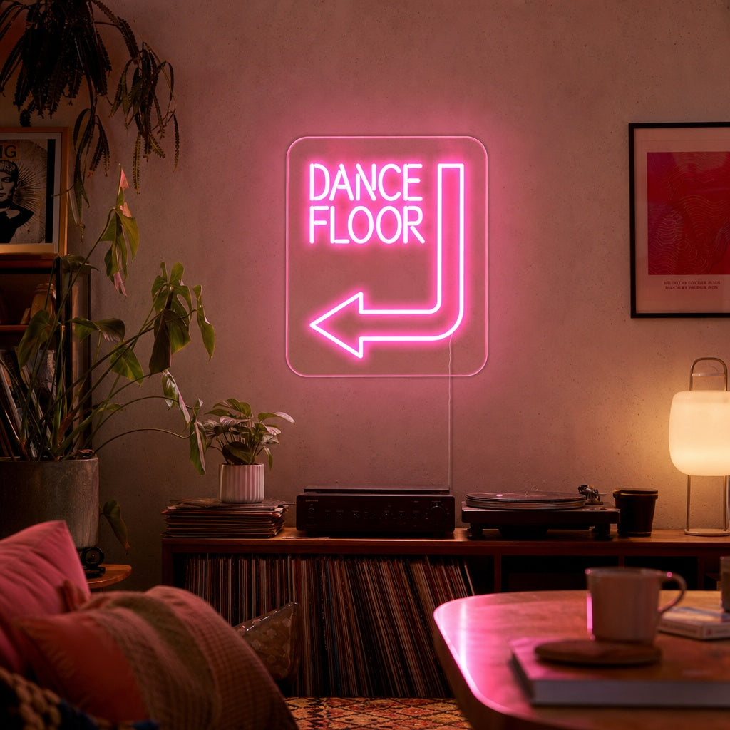 Handcrafted "Dance Floor" neon sign glowing brightly on a decorated party wall