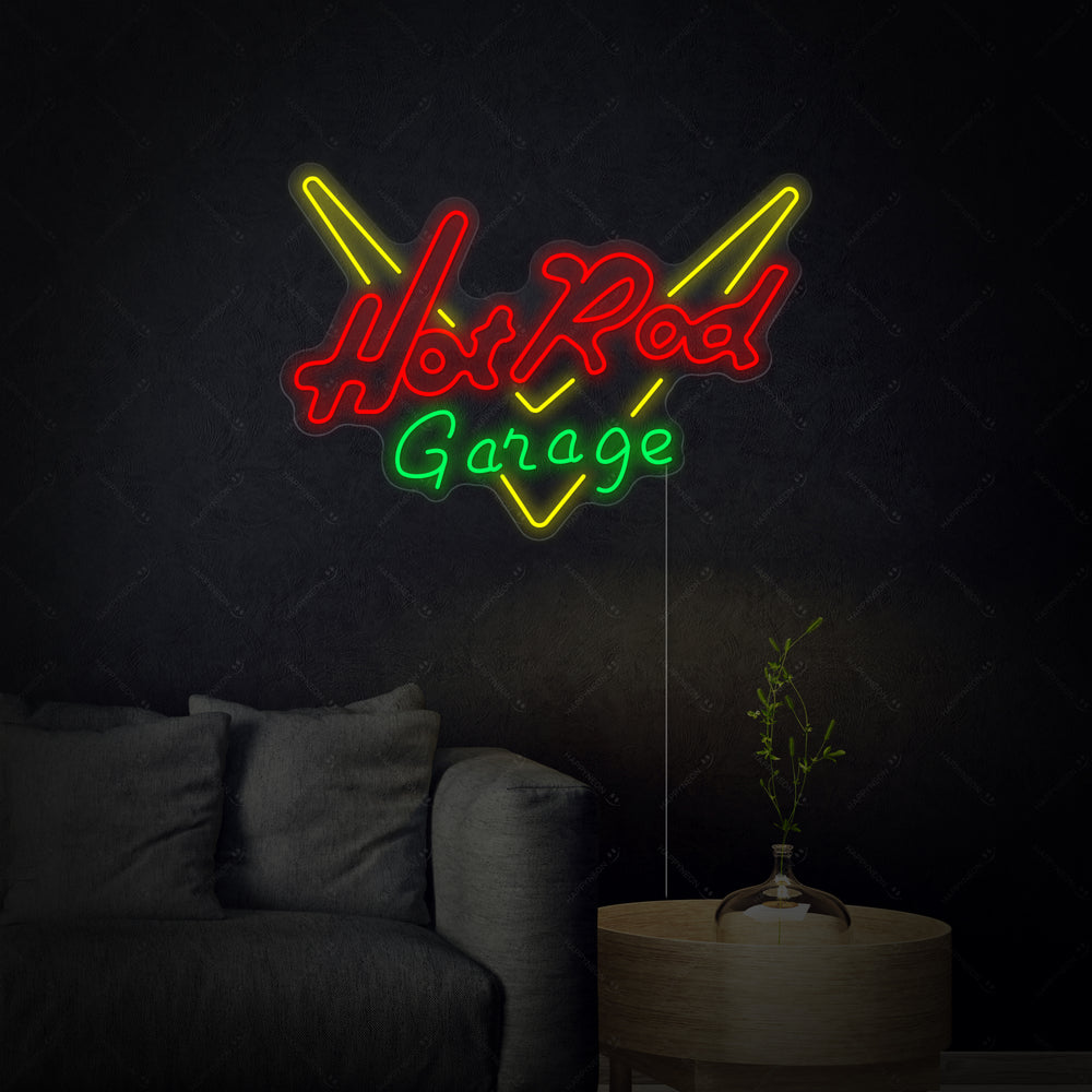 A clear product view of the illuminated 'GARAGE HOT ROD' neon sign against a contrasting background, showcasing the colorful tubing and clear acrylic mounting.