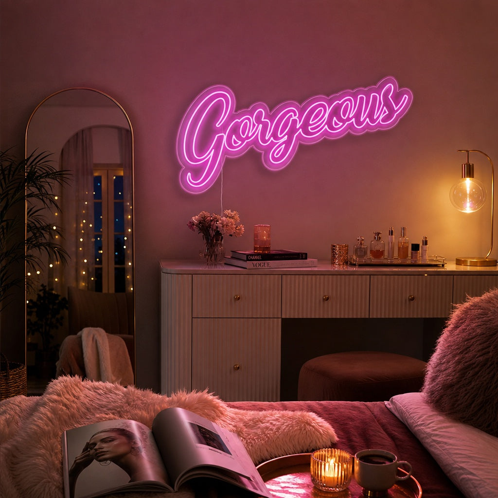 A glowing 'Gorgeous' neon sign in script font displayed on a bedroom wall above a cozy bed, creating a warm ambiance.