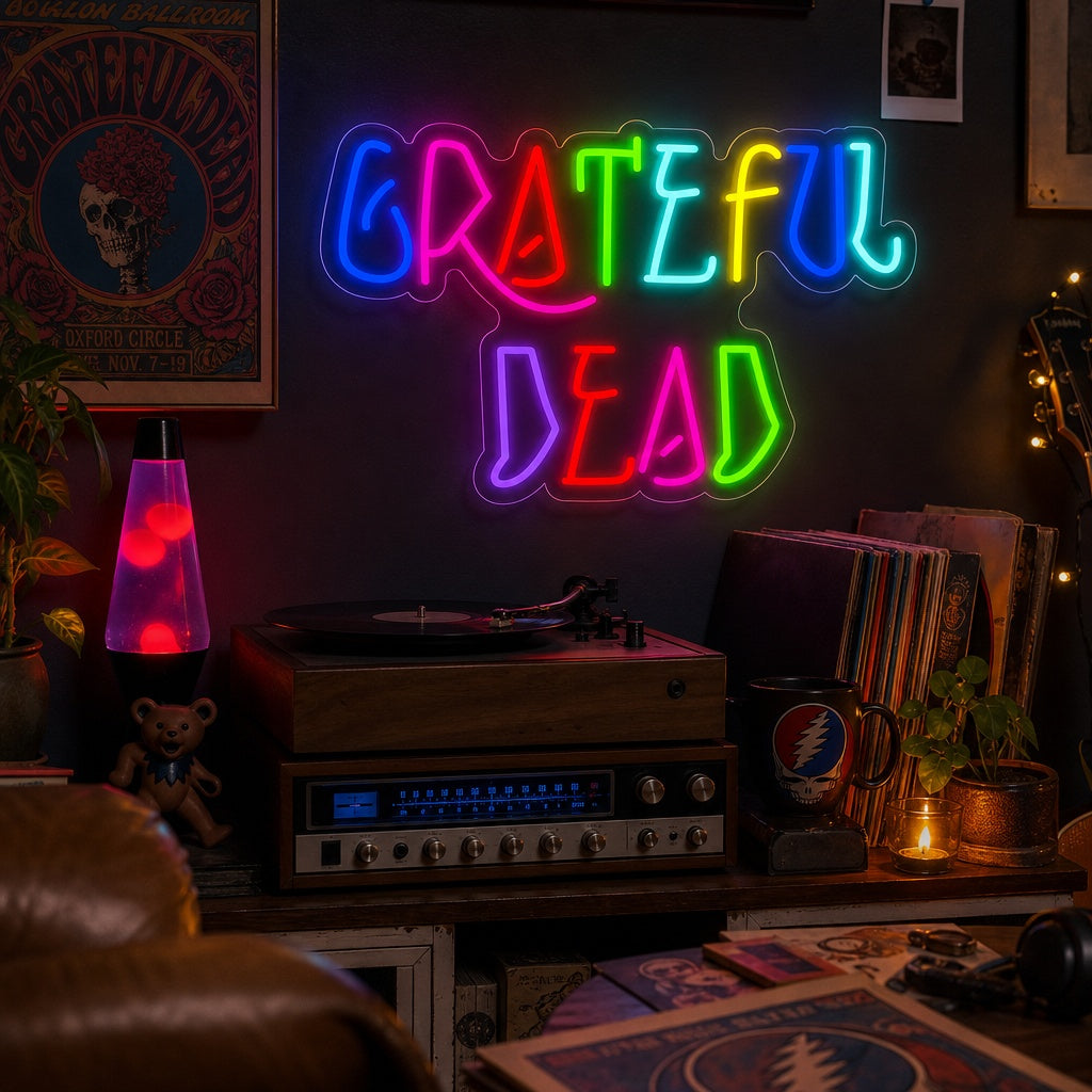 A vibrant 'Grateful Dead' neon sign glowing on a textured brick wall, featuring iconic band logos and imagery in colorful light.