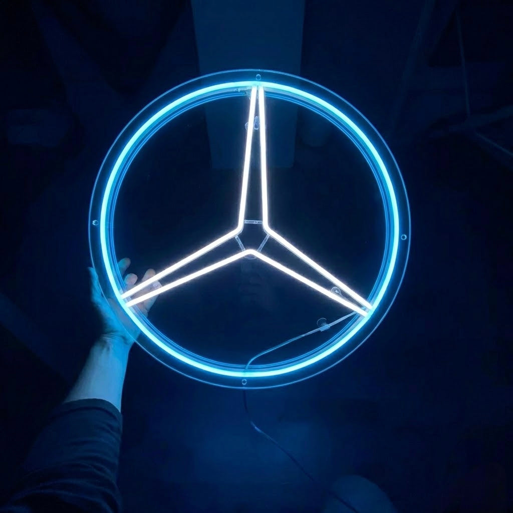 Close-up of a hand holding the luxury three-line star neon sign with real glass tubes, showing internal wiring and physical mounting points in a dark setting.