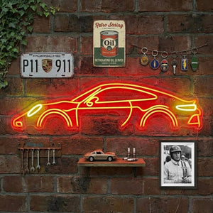 A glowing blue neon sign depicting the detailed outline of a classic sports car, mounted on a garage wall.