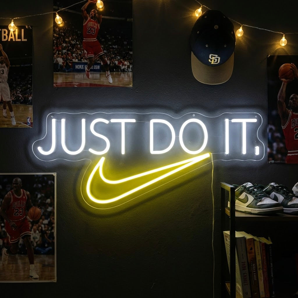 A bright, glowing "Do It" neon sign in white script lettering mounted on a wall in a home setting, providing motivational decor.