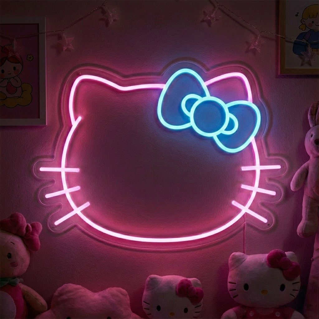 A hand holding an orange and white glowing cat face neon sign in front of a white shelving unit with books and cat-themed toys.