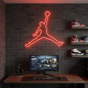 Vibrant basketball jump dunk silhouette neon sign glowing in a sports-themed gaming room setup.