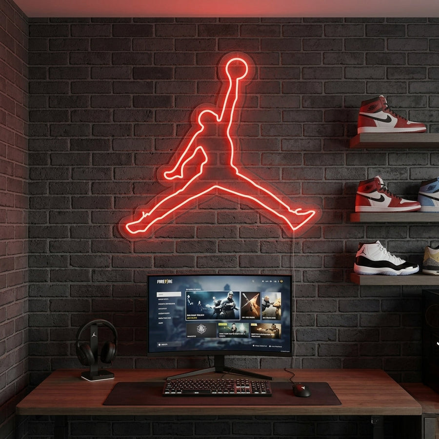 Vibrant basketball jump dunk silhouette neon sign glowing in a sports-themed gaming room setup.