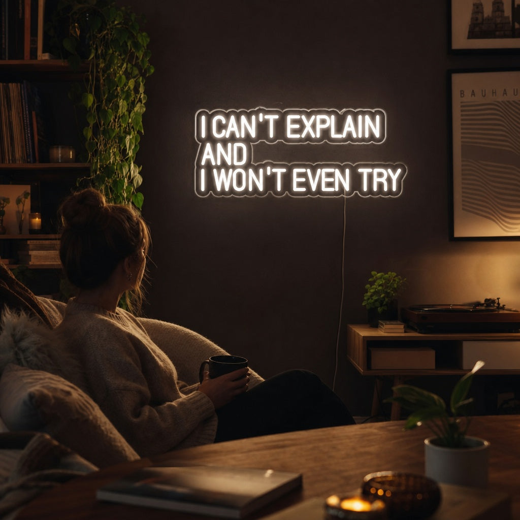 "I Cant Explain And I Wont Even Try" neon sign displayed on a wall in a contemporary living room setting.