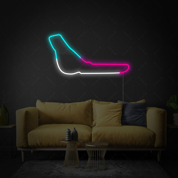 A design visualization of the Monza F1 track neon sign showing the track shape and integrated power cord.