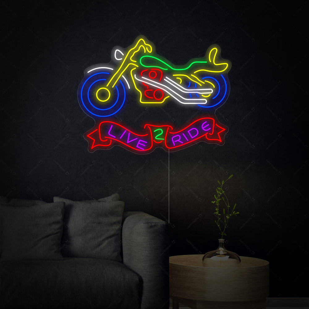 The 'Live 2 Ride' neon sign glowing brightly in blue script on an clear acrylic backing.