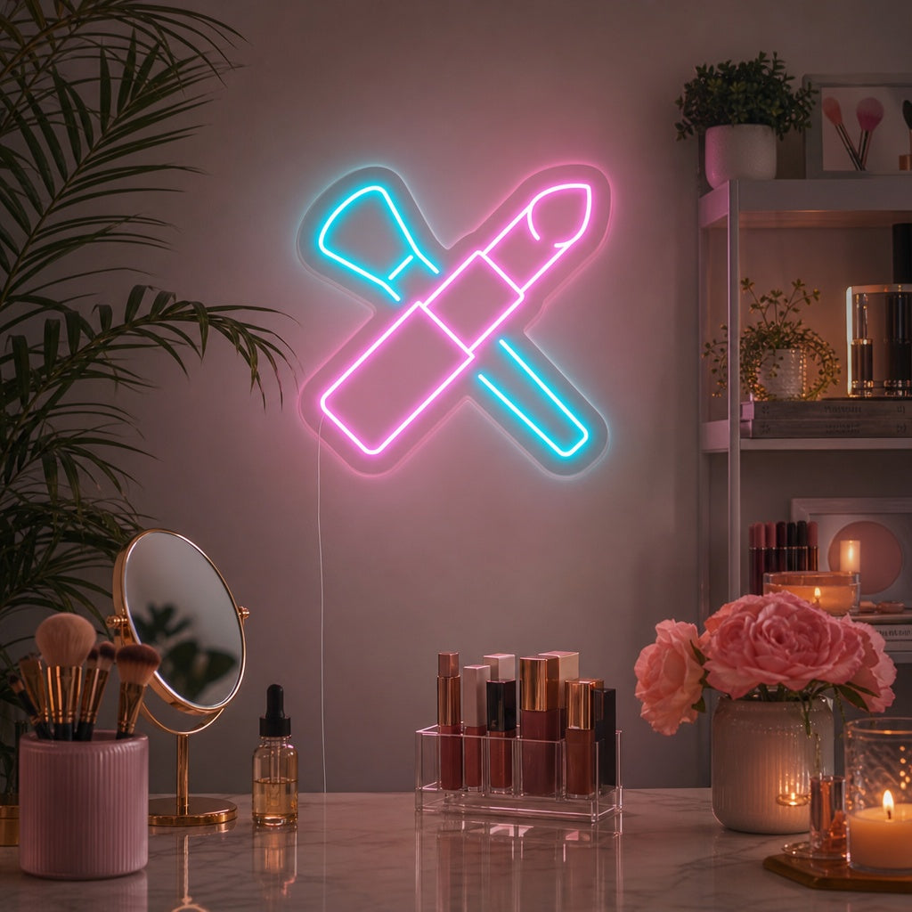 Vibrant "Makeup Brushes" neon sign glowing pink and white in a chic beauty salon setting with brushes displayed below.
