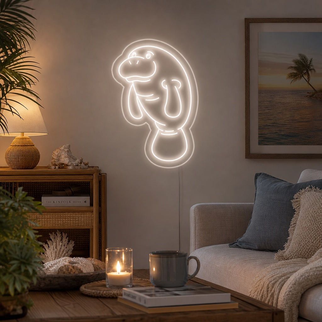 A glowing blue manatee neon sign mounted on a dark wooden plank wall above a shelf with plants.