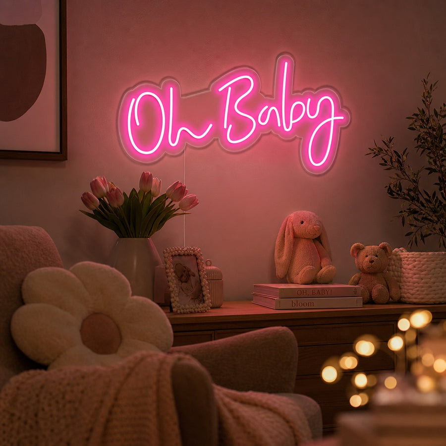 A glowing 'Oh Baby' script neon sign installed as nursery wall decor above a crib.