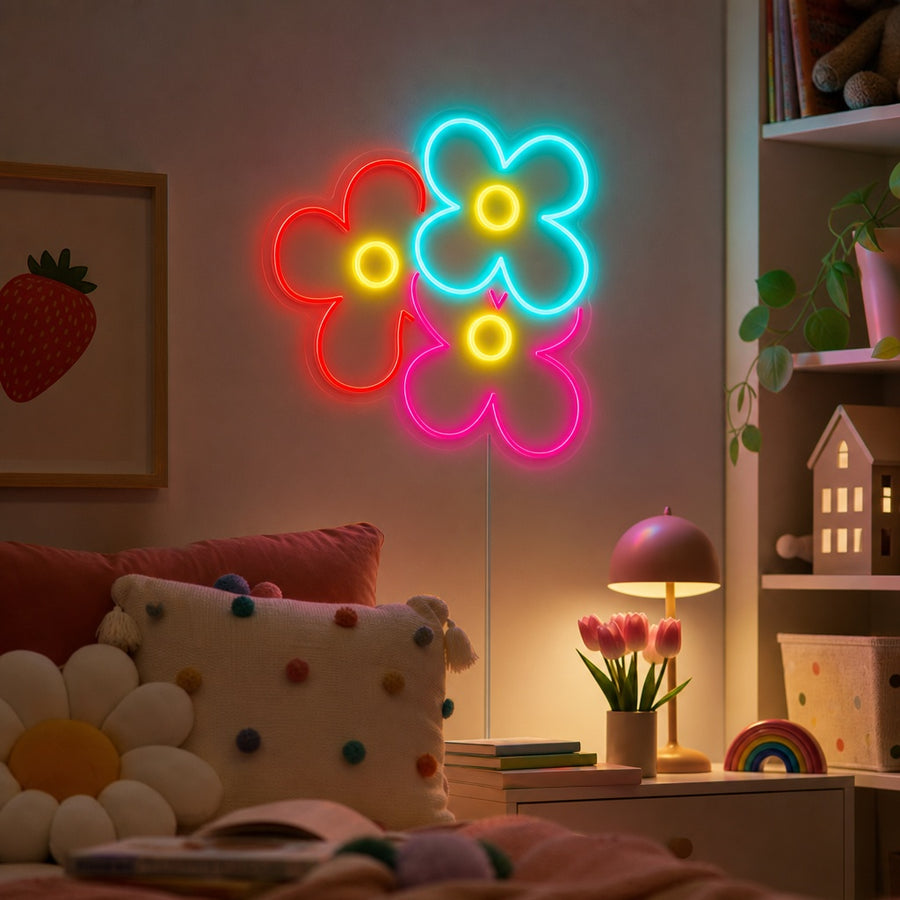 A vibrant glowing Popping Daisy Flower neon sign mounted on a clean white wall in a modern, stylishly decorated kids' bedroom, illuminating a colorful play area and nursery furniture.