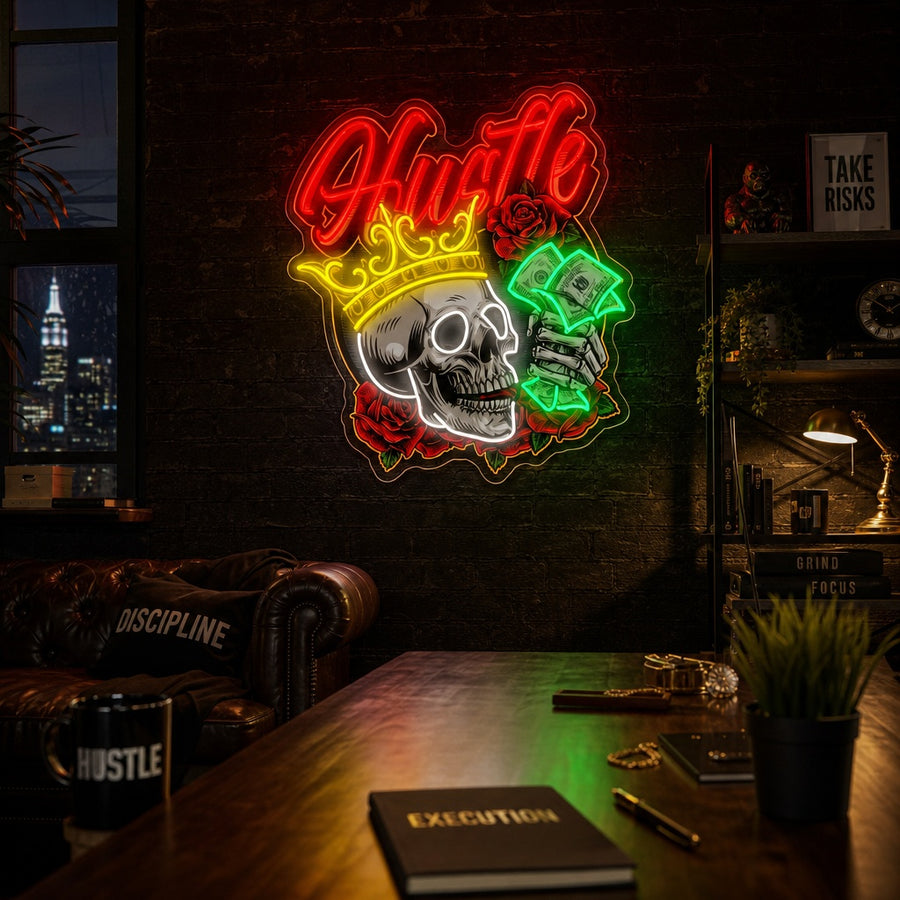 A glowing neon sign featuring an intricate UV-printed graphic of a crowned skull and a skeleton hand holding dollar bills among roses, set against a dark textured wall in a modern room.
