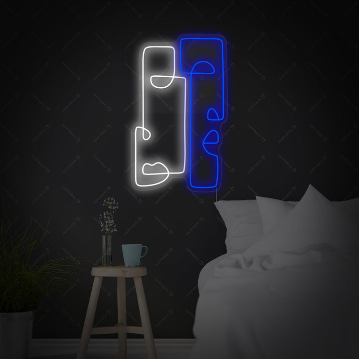 Clear acrylic backed 'Abstract Totem' neon wall sign displaying its unique glowing shape of an abstract face and body.