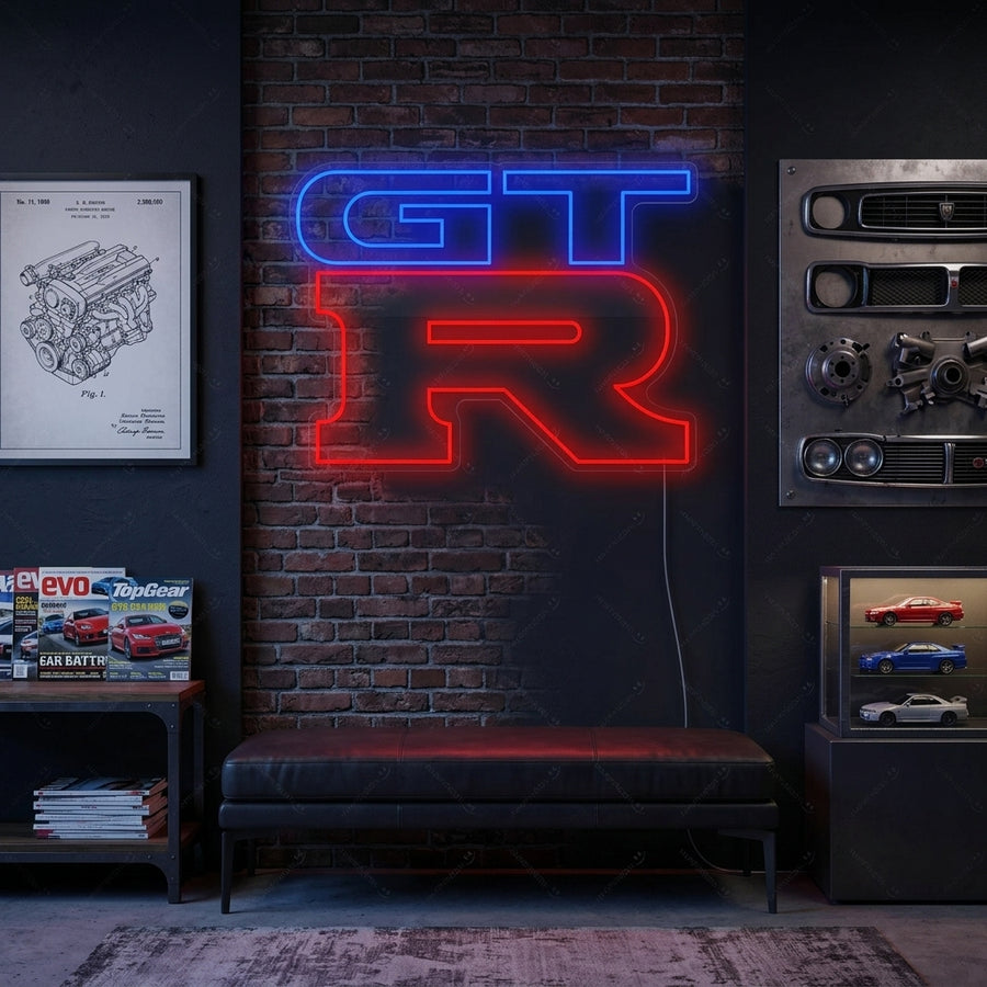 GTR logo neon sign displayed on a modern brick wall, illuminating an apartment lounge area with a car enthusiast theme.
