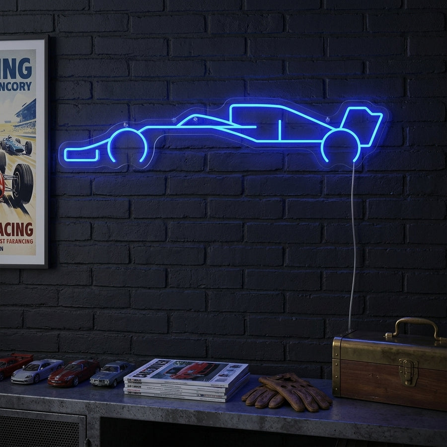 A sleek F1 car neon sign illuminated on a textured dark wall in a racing-themed room.