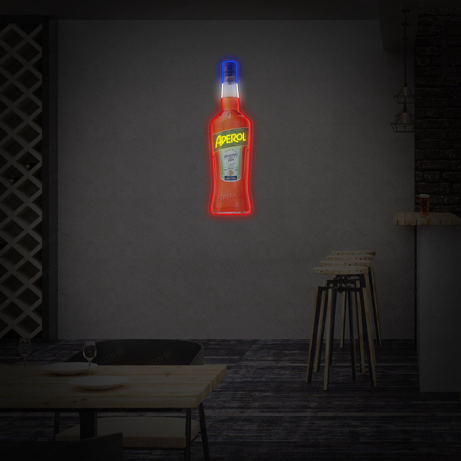 A glowing orange neon light shaped like an Aperol Spritz bottle, with visible clear acrylic mounting backer and power cord, placed in a modern living space.