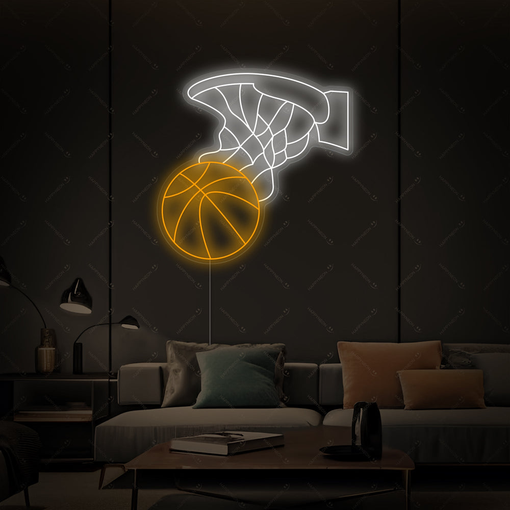 An illuminated basketball hoop neon sign with an orange ball and blue net, casting a colorful glow against a clean background.