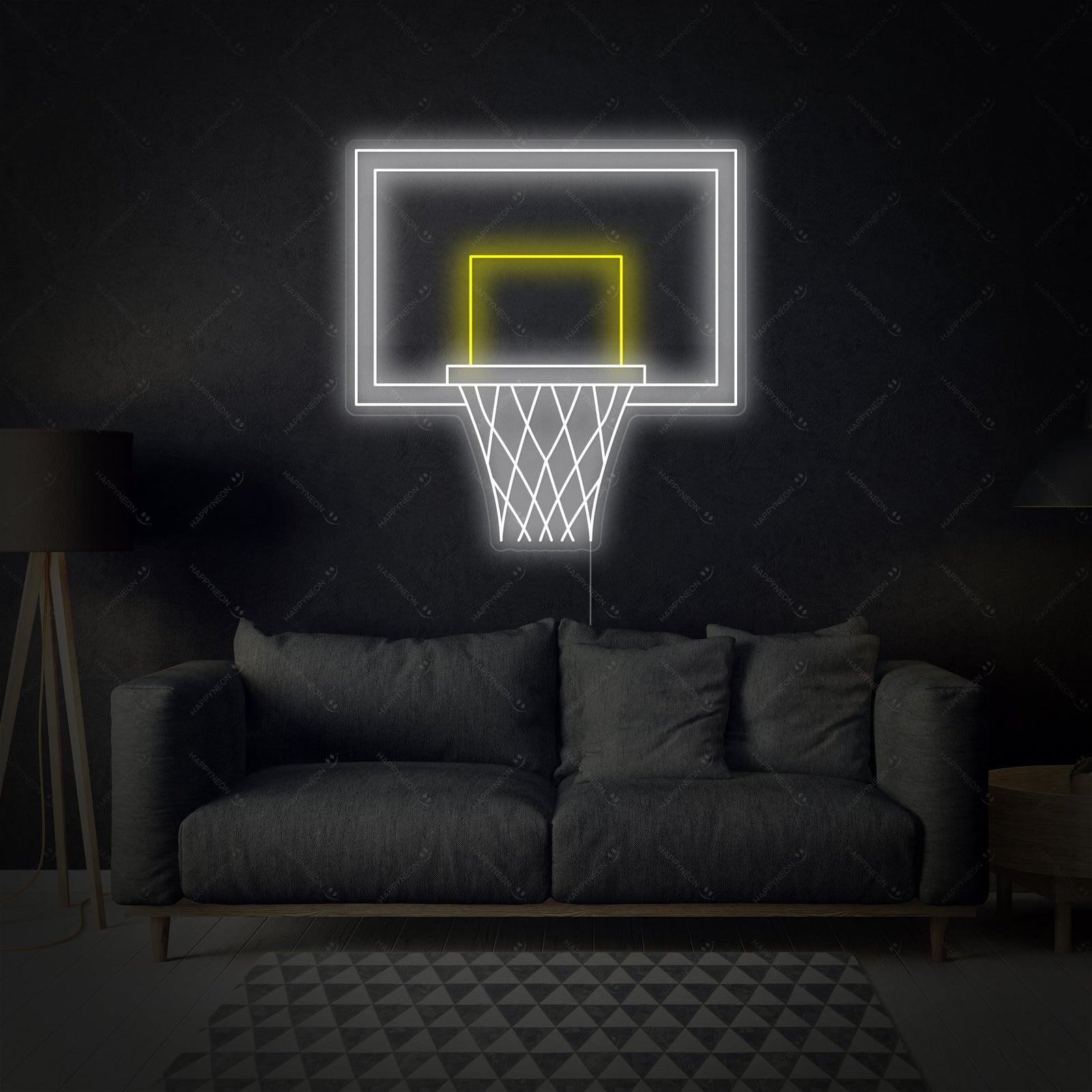 A glowing red neon sign showing a simplified graphic of a basketball hoop and net with an orange basketball above it, displayed against a dark blurred background and a wooden surface.