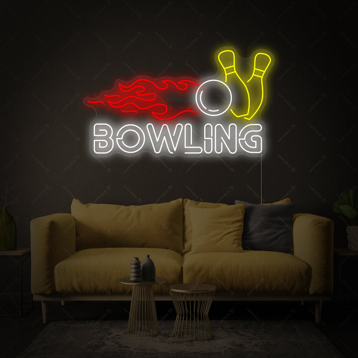 The glowing blue bowling ball and pins neon sign, showing the clear acrylic backing and black power cord against a light grey brick wall.